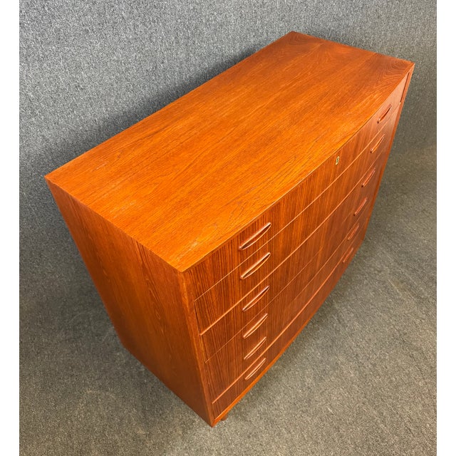 Here is a beautiful Scandinavian MCM tall boy dresser in teak manufactured in Denmark in the 1960's. This lovely case...
