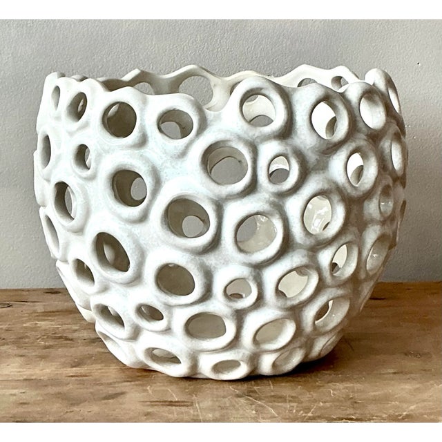 Discover this truly distinctive vintage ceramic bowl, a captivating piece that seamlessly merges bohemian free-spirit with...