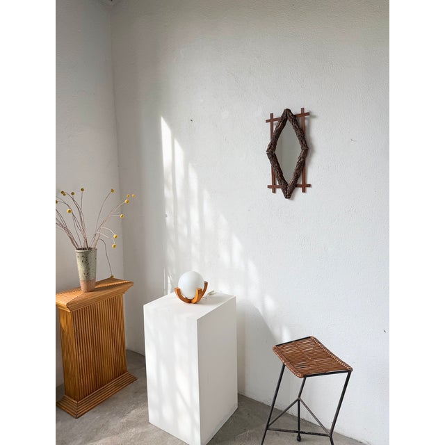 Antique folk art wooden mirror from the 1900s, originating from France. We love the contrast between the diamond-shaped...