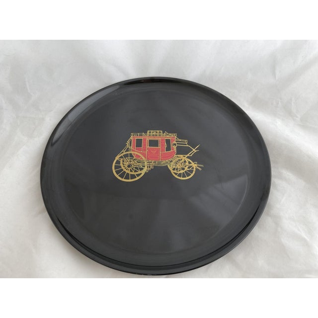 Beautiful Couroc of Monterey California tray with a gold and red stagecoach featured in the center. Dimensions: 10.5"W x...