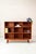 with its clean lines, warm teak wood, and slender base, this bookcase strongly evokes the designs of Peter Hvidt. Crafted...
