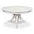 A pale circular top rests over an open geometric base, giving the table scale without enclosing the space beneath it. Four...
