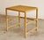 A clean-lined side table by McGuire of San Francisco, finished in the brand’s signature natural rattan tone. The frame has...