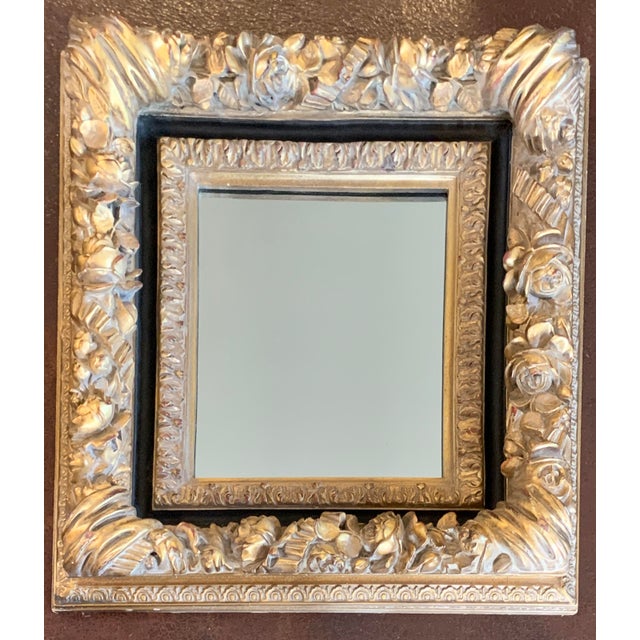 This ornate Rococo Baroque style wall mirror features a beautiful deeply carved floral rose and foliate motif finished in...