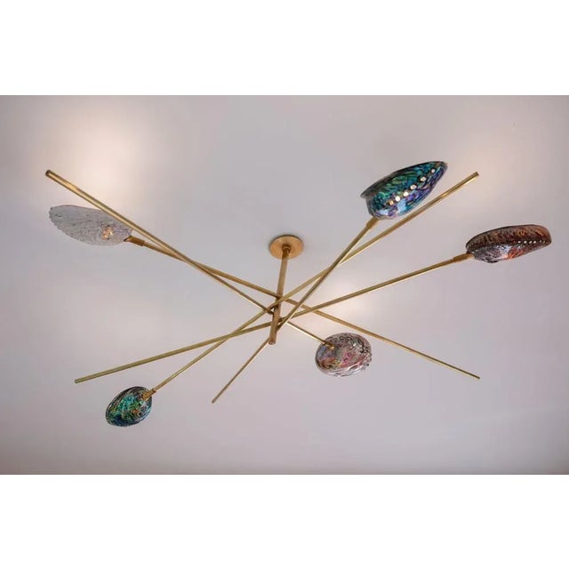 Coquillage chandelier by ludovic clément d'armont materials: brass, blown glass dimensions: diameter 120 x height 40 every...