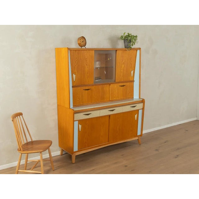 A unique two-piece kitchen cabinet from the 1950s in a design typical of the period. A high-quality body in ash veneer...