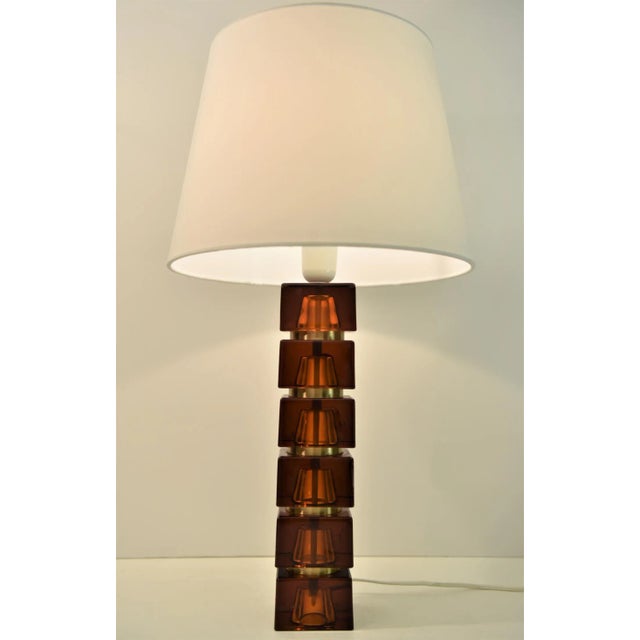 Rare pair Swedish amber coloured art glass table lamps designed by Carl Fagerlund for Orrefors in the 1960´s. They measure...