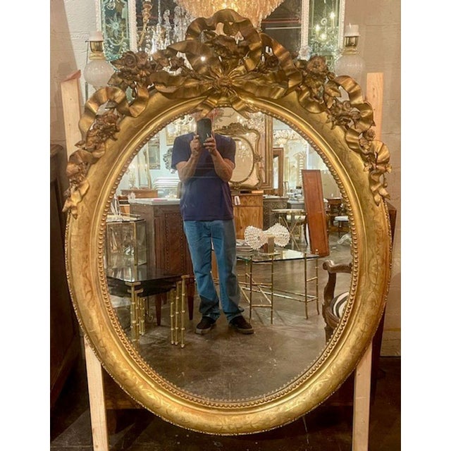 The 19th c. French Louis XV Oval Giltwood Mirror is a timeless and elegant piece of home décor that adds a touch of...