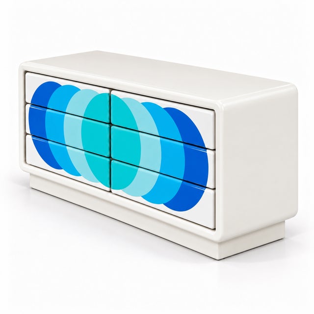 Striking postmodern six-drawer dresser featuring a custom finish with overlapping circles in vibrant shades of blue, aqua,...