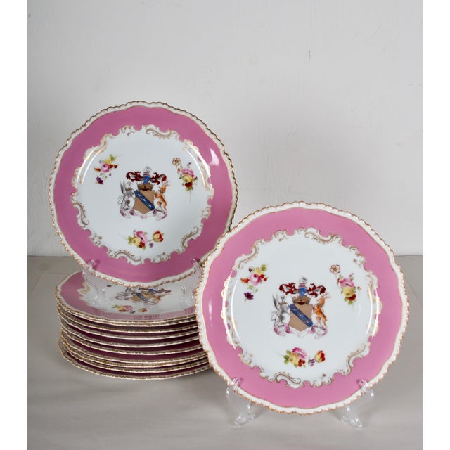 Very rare set of 12 Dinner Plates, with the Earl of Derby Coat of Arms, dated 1830. On Pompadour Ground- The plates are in...