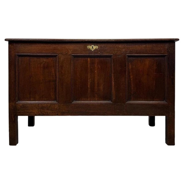 A handsome and substantial 18th-century English Georgian coffer, beautifully crafted in oak and combining generous storage...