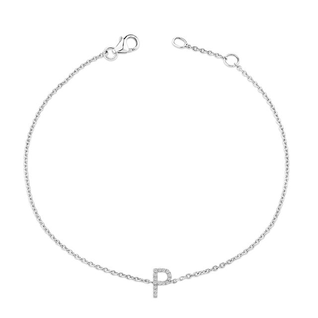 Immerse yourself in the understated elegance of this 10K white gold bracelet, rhodium-plated for an enrapturing shimmer...