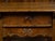An English Georgian period oak low side table from the early 19th century, with single drawer and scalloped apron. Created...