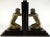 A pair of kneeling men are gazing in their respective mirrors in this pair of midcentury bookends. The nude men have...