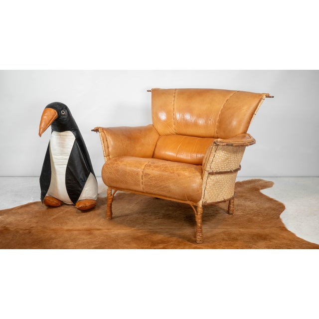 Pacific Green Furniture 'Navajo' lounge chair, circa 1990s. Luxurious distressed cognac bovine leather with plush padded...