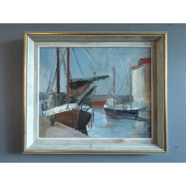 HARBOUR AT REST Size: 21.1 x 24.8 inches (including frame) Oil on canvas An atmospheric mid-century seascape that captures...