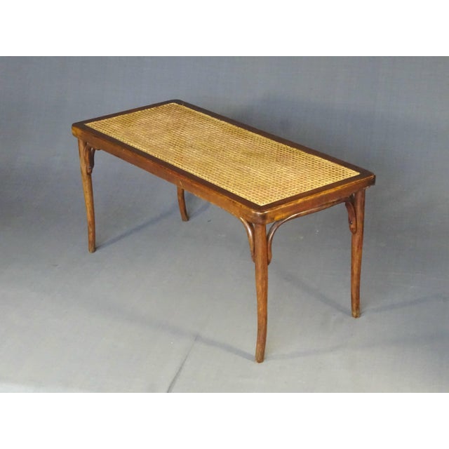 Very good condition, recent caning (less than 10 years old) This piece is attributed to the mentioned designer/maker. It...