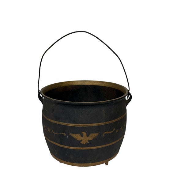 Antique cast iron cooking pot with hand painted eagle and stars. The hand painted design give this item it's American...