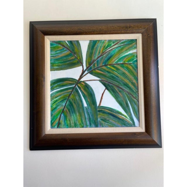 Pair of acrylic paintings of palms, in bold shades of green, brown and yellow.. Professionally framed in medium all wood...