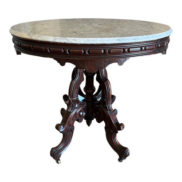 Antique Thomas Brooks Victorian Walnut Oval Parlor Table With White Marble Top and Casters For Sale