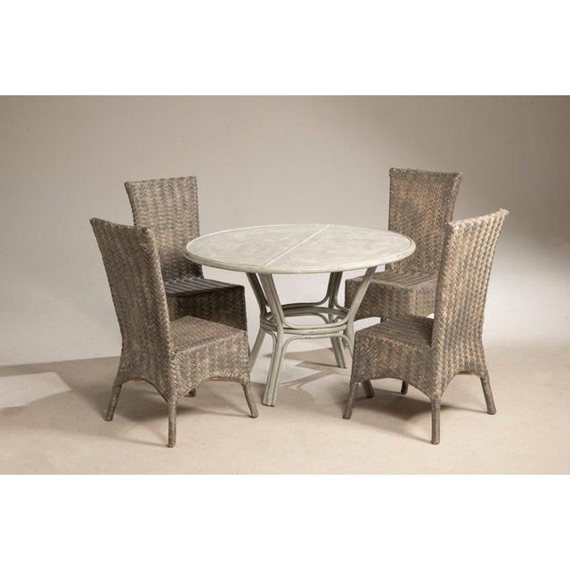Pair of whitewashed bamboo tables, designed to be paired with four rattan chairs in the same finish. The two tables are...