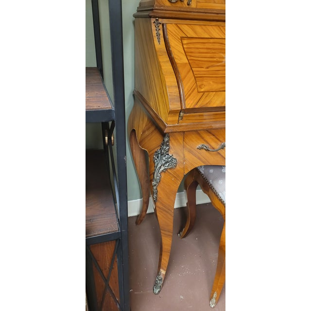 Fine vintage French inlaid secretary desk with small bench. Features fall front desk, inlaid frame, glass door upper...