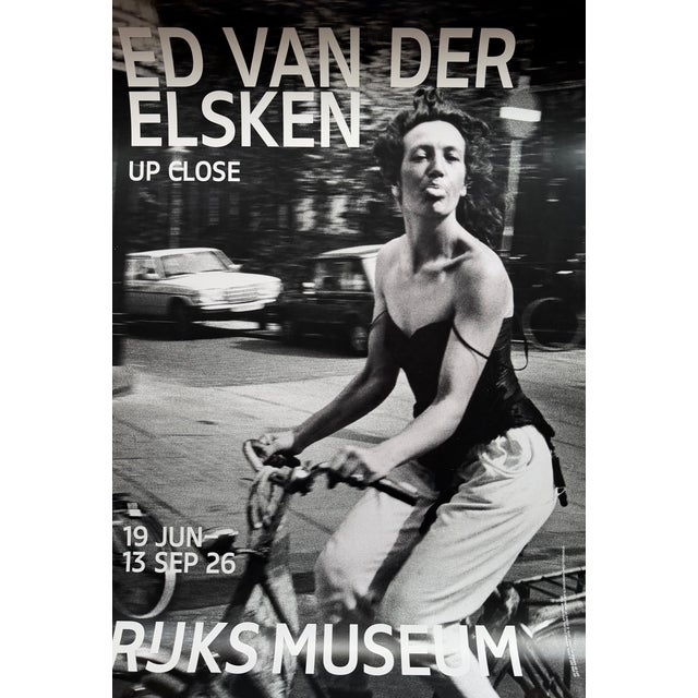 Elevate your space with this striking exhibition poster featuring Ed van der Elsken’s Woman Cycling from 1983. Van der...