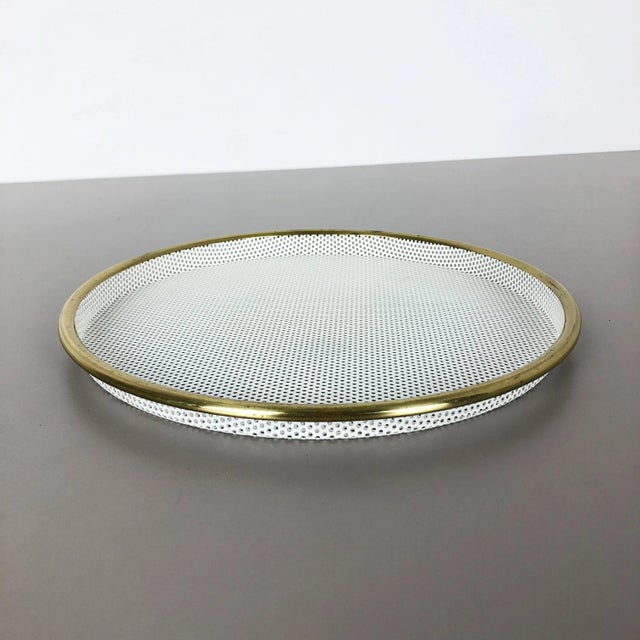 Metal tray. In style of Mathieu Mategot. Origin: France, 1960s. This original vintage tray element was produced in the...