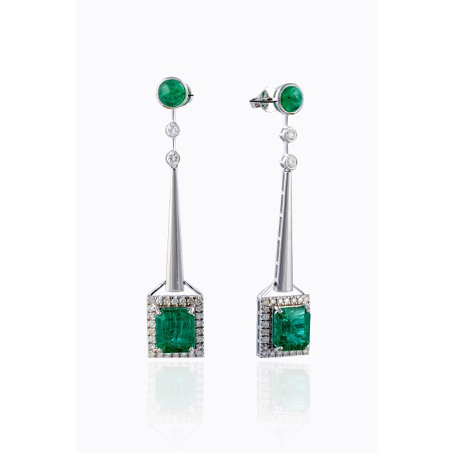 this is an elegant natural Zambian Emerald earrings with vsi clarity diamonds and G colour. the emeralds are of very high...
