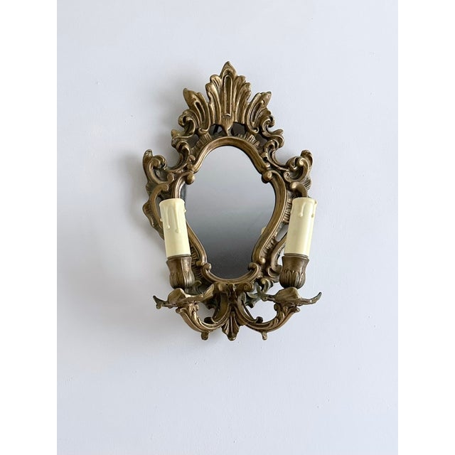 Mid-Century French Rococo Revival Brass Wall Mirror Sconce, 1950s, in Very Good conditions. Designed 1950 to 1959 Up to...