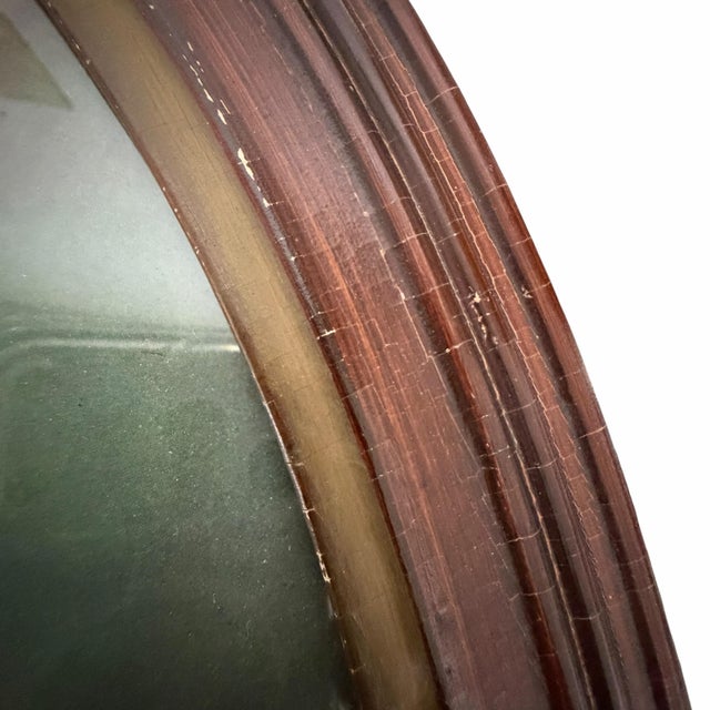 Vintage oval all wood carved frame containing a lithograph titled “Age of Innocence”. Some tiny scrapes in places on the...