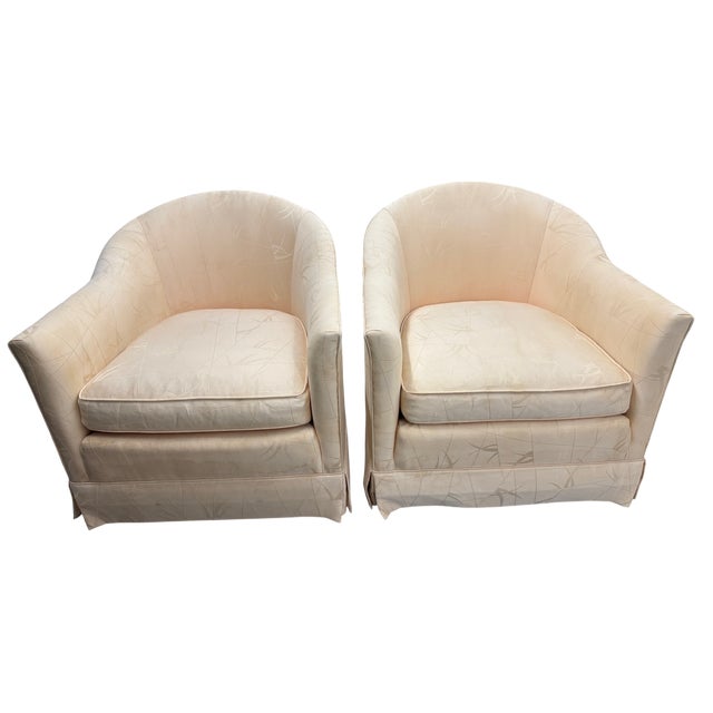 Baker Furniture Co. Barrel Chairs on Caster Wheels - A Pair This pair of mid-century modern chairs is upholstered with a...