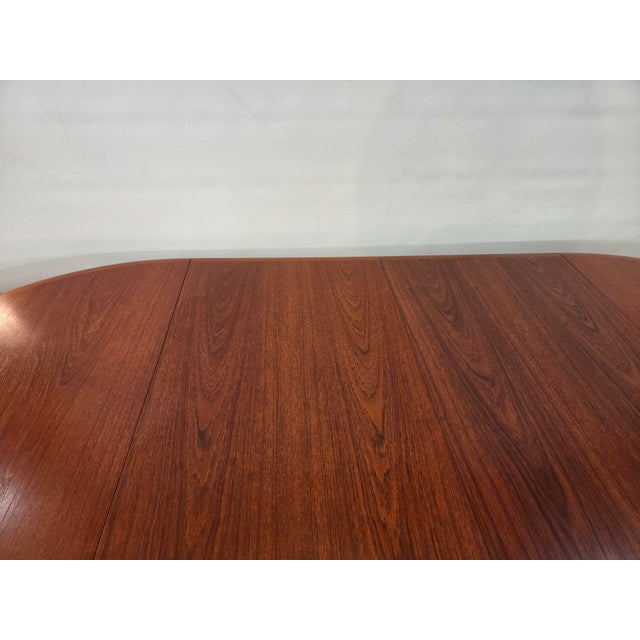 This is A Danish Teak 1960s Dining table made in Denmark. The table is round 46 inches closed open one leaf 65.5 inches...