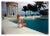 CZ by the Pool 1955 American socialite Mrs. Winston F. C. Guest (aka CZ Guest, 1920 – 2003) perches on the edge of the...