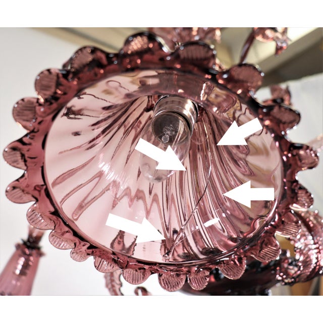 This monumental Mid-Century Murano chandelier is a dramatic masterclass in Venetian glassmaking, translating the romance...