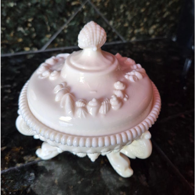 Bring a touch of whimsical, mid-century coastal elegance to your interior styling with this striking Westmoreland Glass...