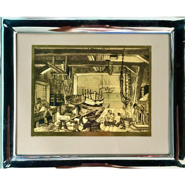 A vintage framed Talio-Chrome print of “The Old Boat Works” by Lionel Barrymore, produced by Brown & Bigelow in the...