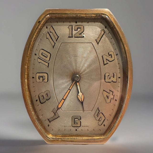 This listing is for an antique desk clock by Goering. This Swiss- made clock dates to the 1920s. It has a nice Art Deco...