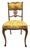 An elegant matching armchair and side chair, provisionally dating to circa 1890–1910, capturing the decorative richness of...
