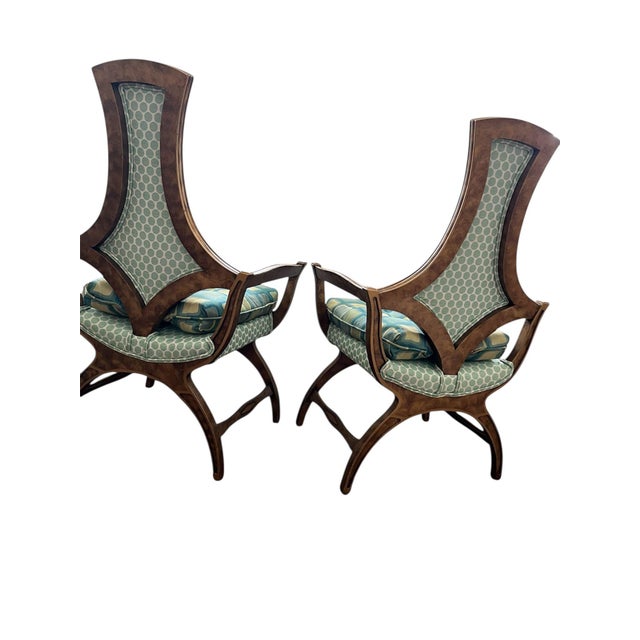 This vintage pair of Hollywood Regency chairs have been freshly reupholstered in a playful mix of MCM geometric patterns....