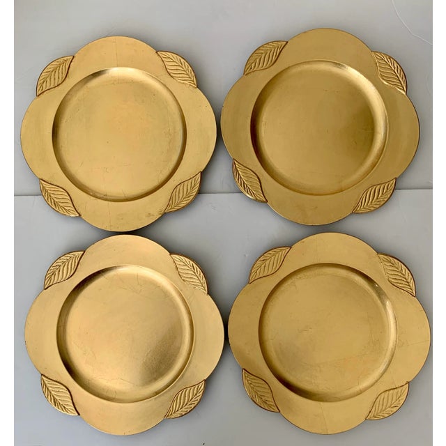 Nice set of 4 Gold Lacquered chargers from Federated Department Stores in 2000. Gold front - black lacquered back.