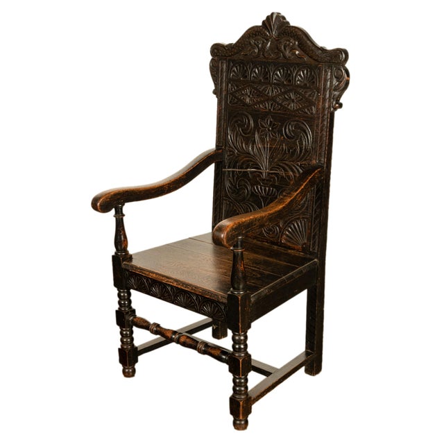 A good carved antique oak open wainscot carved armchair, from the Charles II period, Yorkshire, circa 1680. The chair with...