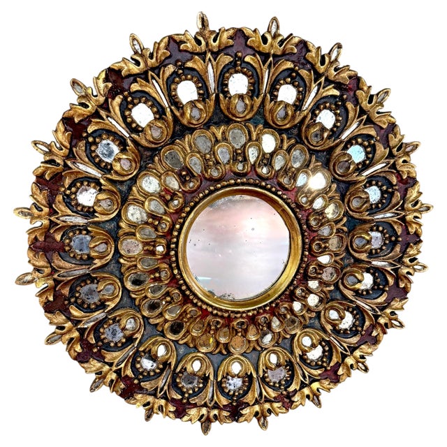 Italian Neoclassical Polychromed and Giltwood Sunburst Mirror Italy, Early 20th Century Circular Italian carved wood...