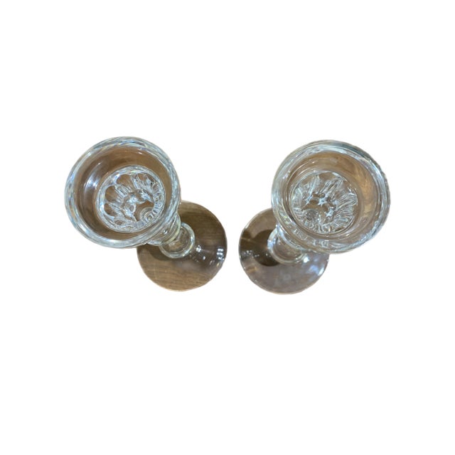 These are a pair of Waterford candlesticks in the Curraghmore pattern. The Waterford mark is stamped on the bottom. They...