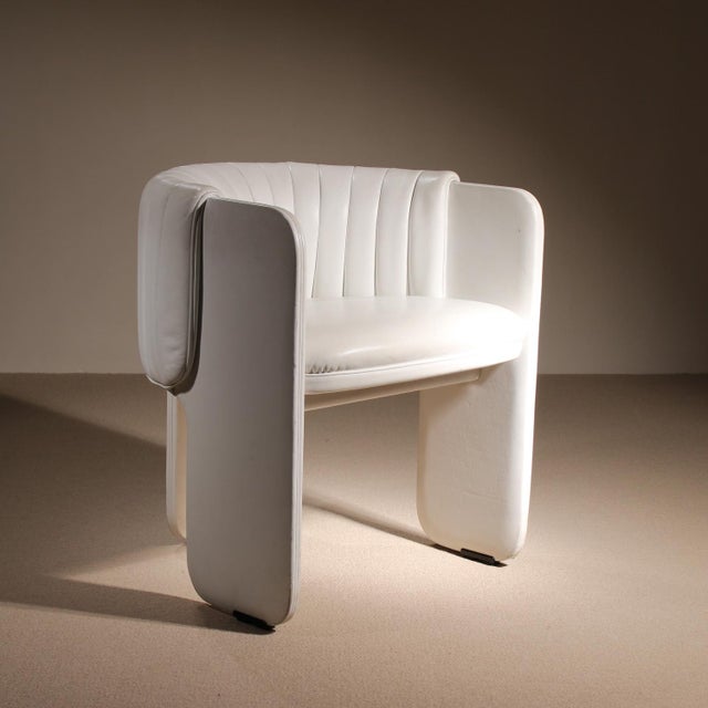 A sculptural 1972 design by Luigi Massoni for Poltrona Frau. This armchair features an enveloping form in white leather...