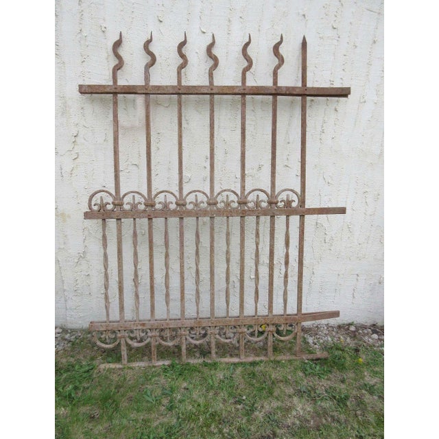 This gate is a wonderful piece of architecture. Heavy, tight and sturdy. The piece does show signs of age related wear...