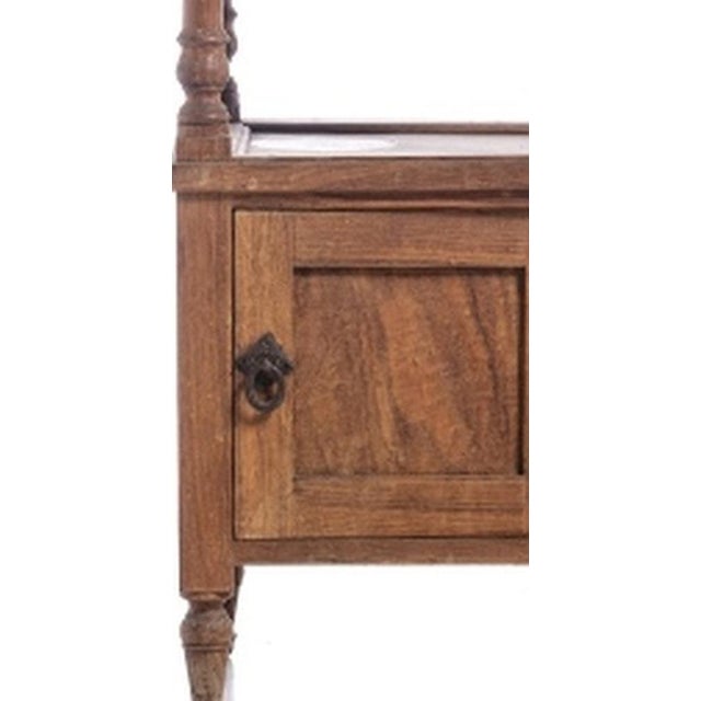 Portuguese bedside table; early 20th century; made of chestnut wood with a marble top; one drawer and one door....