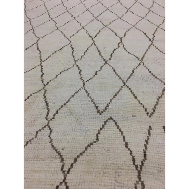 Hand knotted of top quality natural dyed wool and cotton in Pakistan. This unique and innovative Navajo Rug is an eye...