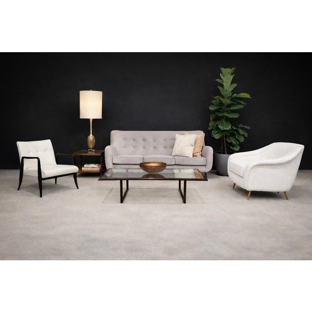 Designed by Joaquim Tenreiro and produced during the mature phase of Brazilian Modernism, this refined coffee table...