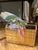This magazine rack hails from the !970's, probably from England, and is wood clad in brass. The brass has a rippled almost...